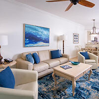 Chic living space with sofas and a blue artwork at Bellasera Resort in Naples