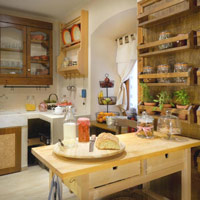 Warm, rustic kitchen with open shelves and a central island