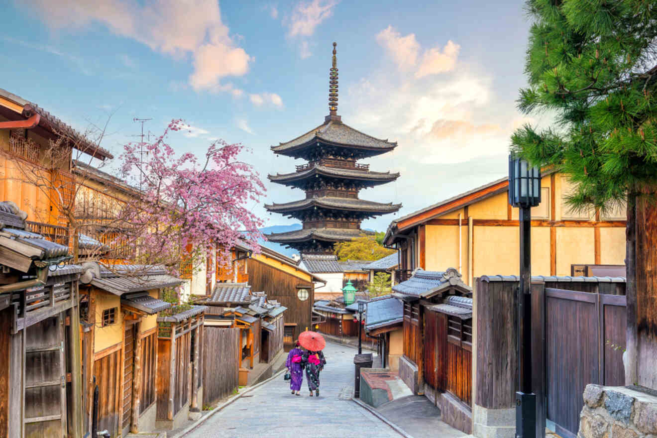 An atmospheric street in Kyoto with traditional wooden houses and a five-story pagoda, under a sky with cherry blossoms in bloom