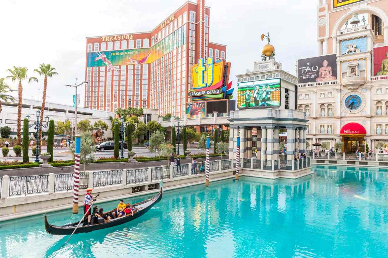 Venetian Hotel's iconic outdoor gondola ride on the Las Vegas Strip with the Treasure Island Hotel in the background