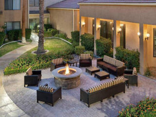 Inviting outdoor seating area with a fire pit and lounge chairs