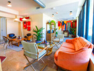 Vibrant and artistic hotel lounge with eclectic furniture and bright colors