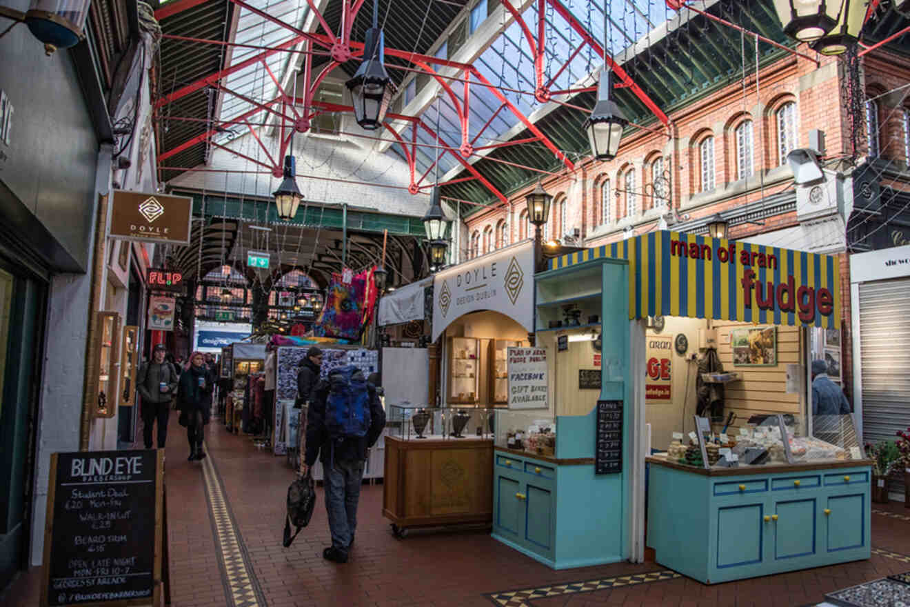The vibrant and eclectic interior of St. George’s Arcade in Dublin, with various stalls and shoppers browsing.