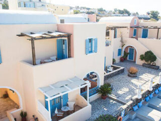 Villa's courtyard with cobalt blue accents, traditional architecture, and a peaceful seating area