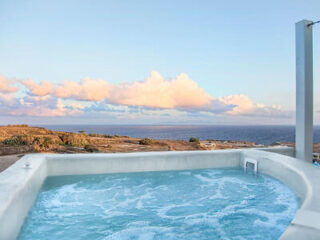Luxurious rooftop hot tub with a panoramic view of the Aegean Sea
