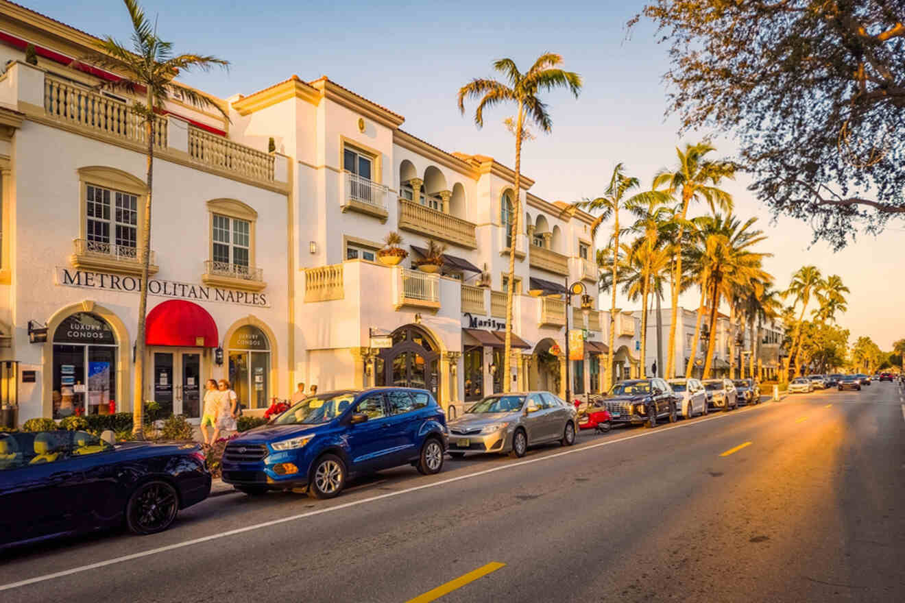 Sunset view of Fifth Avenue South in Naples, FL, lined with palm trees and Mediterranean-style buildings, bustling with cars and pedestrians