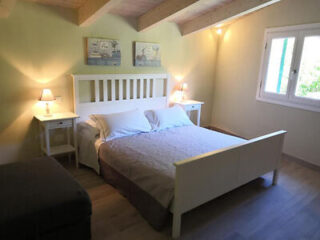 Bright and airy bedroom with a comfortable double bed,