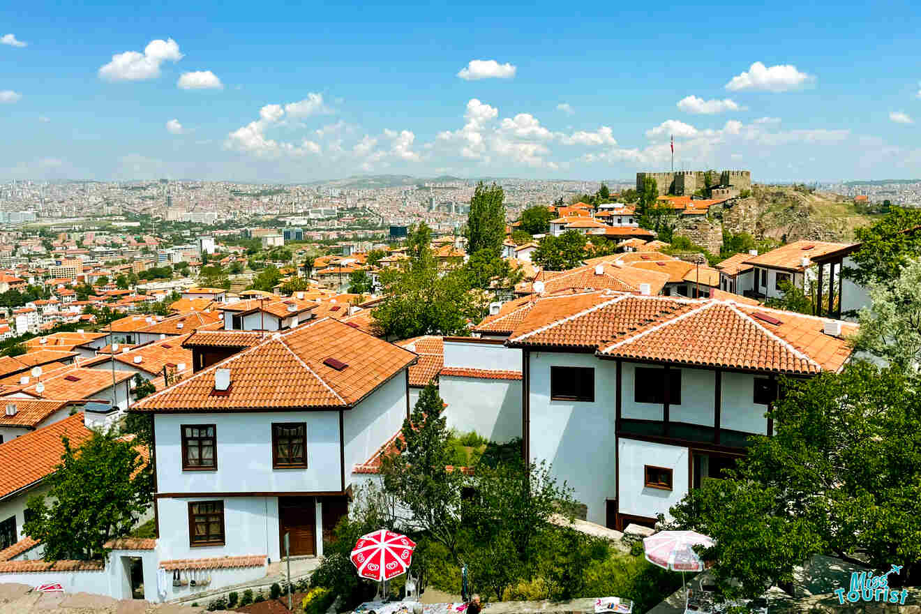 Elevated view of Ankara's old town with traditional houses and the ancient citadel in the distance on a bright day