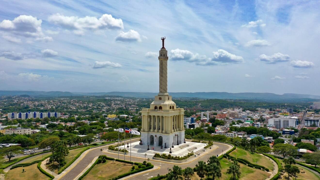 An aerial shot of Santiago de los Caballeros featuring the iconic Monument to the Heroes of the Restoration.