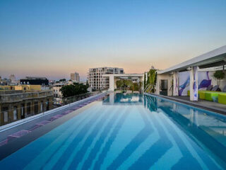 Rooftop swimming pool with panoramic views of the city skyline