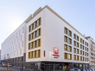 The exterior of MEININGER Marseille Hotel showing a modern, clean-lined facade