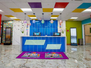 Colorful and playful reception area, featuring a vibrant mural with the Philadelphia skyline