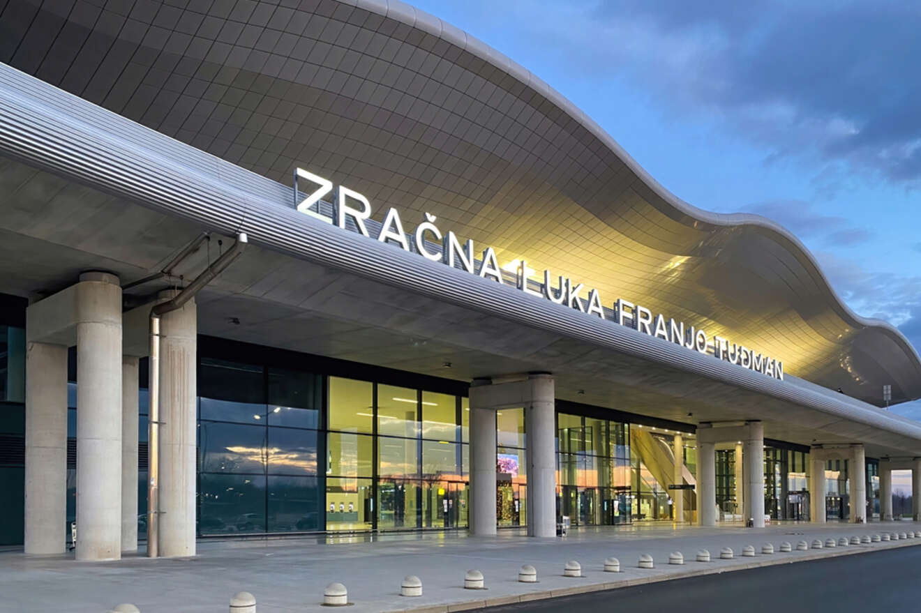 Front exterior of Zagreb Airport (ZAG) with the name 'Zračna Luka Franjo Tuđman' prominently displayed above the entrance