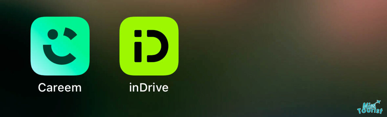 Close-up of smartphone screen displaying app icons for Careem and inDrive, popular ride-hailing services, against a dark background