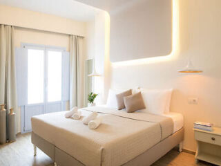 Bright and modern bedroom with a distinctive neon light feature