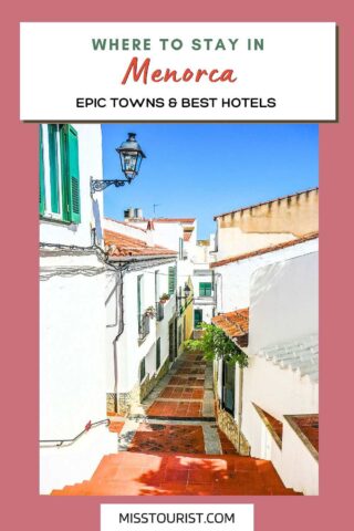 Guide cover for 'Where to Stay in Menorca' showcasing a charming street in Menorca with traditional white buildings, green shutters, and a cobblestone path leading downwards