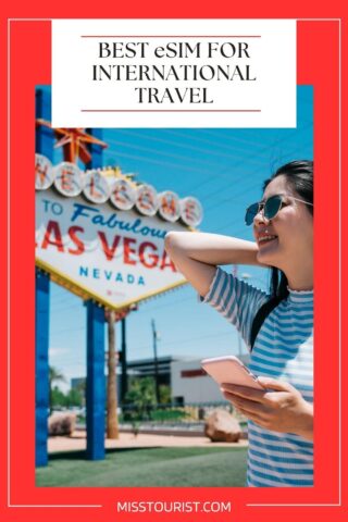 A woman in a striped shirt and sunglasses stands in front of the "Welcome to Fabulous Las Vegas" sign, looking up and smiling while holding a smartphone. Text above reads "BEST eSIM FOR INTERNATIONAL TRAVEL.