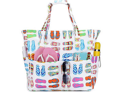 A colorful tote bag with a flip-flop pattern filled with items including pink flip-flops, sunglasses, a yellow bottle, and a bunny plush toy.
