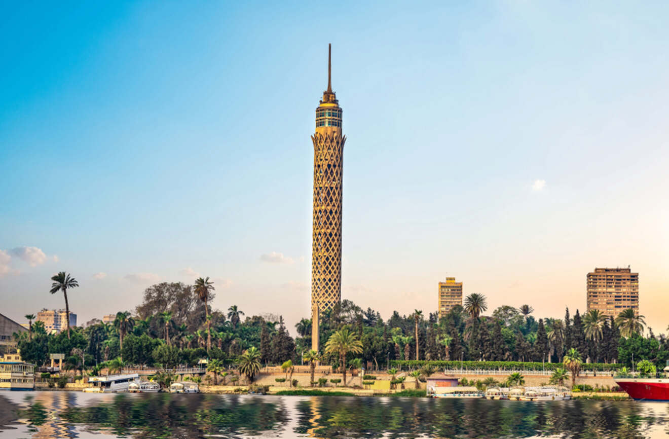 Daytime view of Cairo Tower and the city skyline along the Nile River.