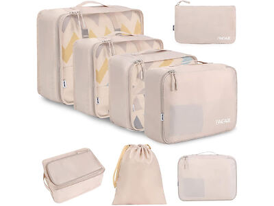 A set of beige travel packing cubes and pouches of various sizes, some with mesh openings and others with drawstring or zipper closures, displayed against a white background.