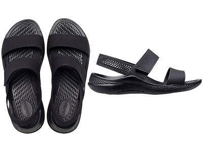 A pair of black sandals with crisscrossing straps and a side view showing the cushioned insole and breathable design.