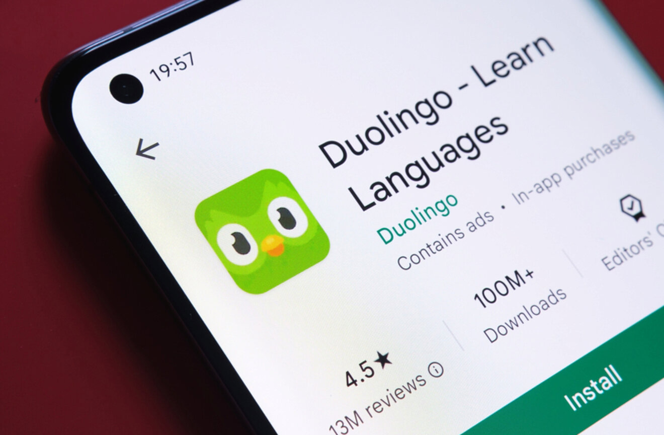 Close-up of a smartphone screen displaying the Duolingo app with the text "Duolingo - Learn Languages."