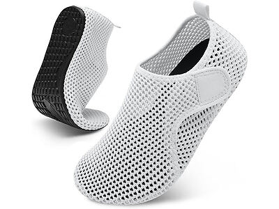 A pair of white, mesh, slip-on water shoes with black soles, one upright and one flexed, is displayed against a white background.