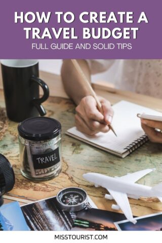 Person writing in a notebook at a table with a travel jar, a compass, a map, and a model airplane. The text reads, "How to Create a Travel Budget - Full Guide and Solid Tips.