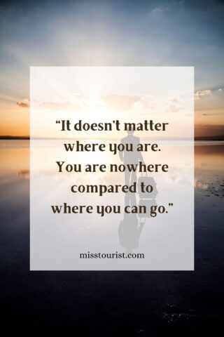 Image of a person walking with a suitcase at sunset with the quote "It doesn't matter where you are. You are nowhere compared to where you can go." and the website "misstourist.com" displayed on the image.