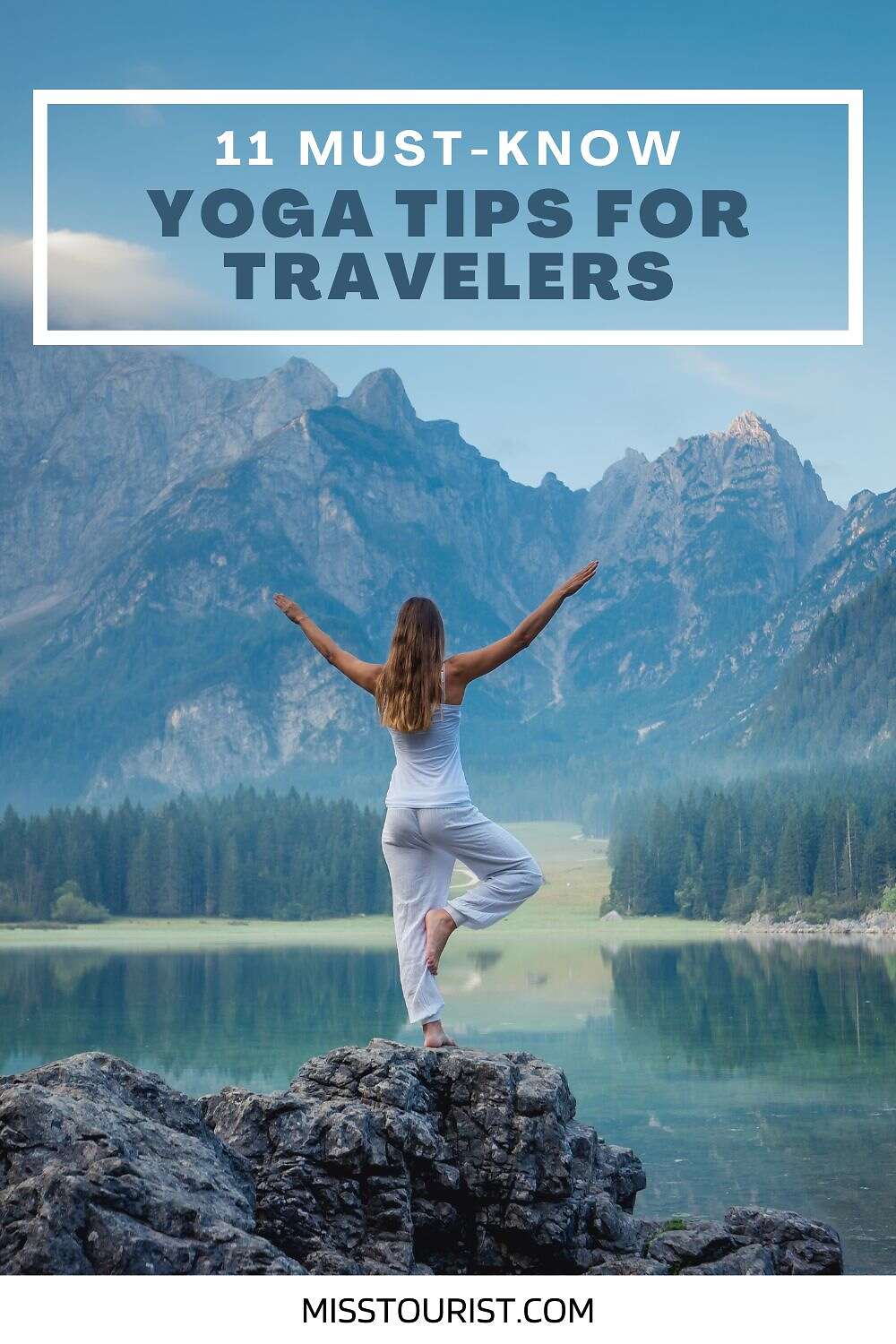 A person wearing white stands on a rock by a lake, performing a yoga pose. Mountains and trees are in the background. Text reads "11 Must-Know Yoga Tips for Travelers" with "misstourist.com" at the bottom.
