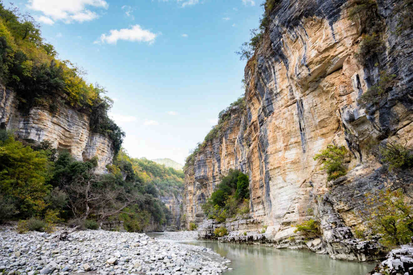 The stunning Osum Canyon, with its steep cliffs and river flowing through the rocky landscape.