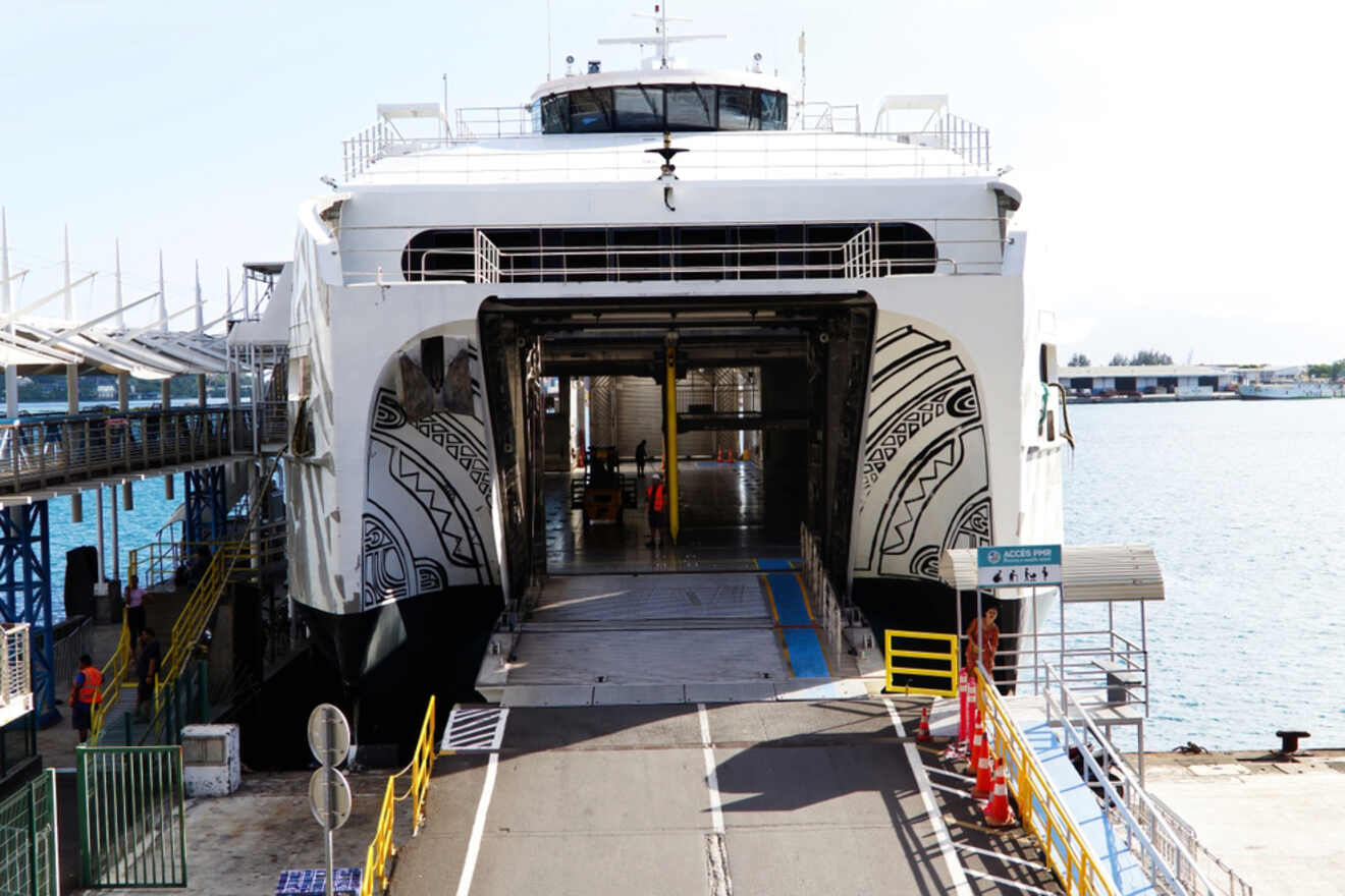 A close-up view of the loading area of the Aremiti Ferry 2, with passengers and vehicles visible.