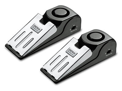 Two black and silver wedge-shaped door stop alarms with the brand name "EDIMAX" displayed on the front, featuring adjustable sensitivity settings.