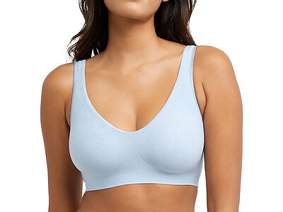 Woman wearing a light blue seamless bra.