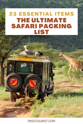 A safari vehicle on a dirt path with passengers observing a giraffe. Text above reads "23 Essential Items: The Ultimate Safari Packing List." Scenery includes trees and grassy landscape.