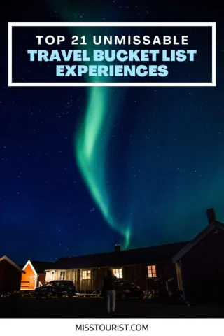 Night sky with the Northern Lights above buildings, captioned "Top 21 Unmissable Travel Bucket List Experiences" with the website "misstourist.com" at the bottom.