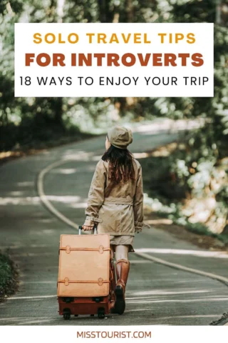 A person wearing a hat and coat walks down a road with a suitcase. Text reads, "Solo Travel Tips for Introverts: 18 Ways to Enjoy Your Trip" and "misstourist.com".