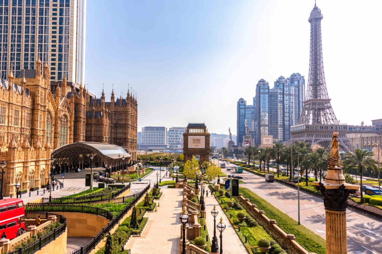 View of the Cotai Strip in Macau, featuring ornate European-style buildings and the replica Eiffel Tower, with palm-lined streets and modern skyscrapers in the background.