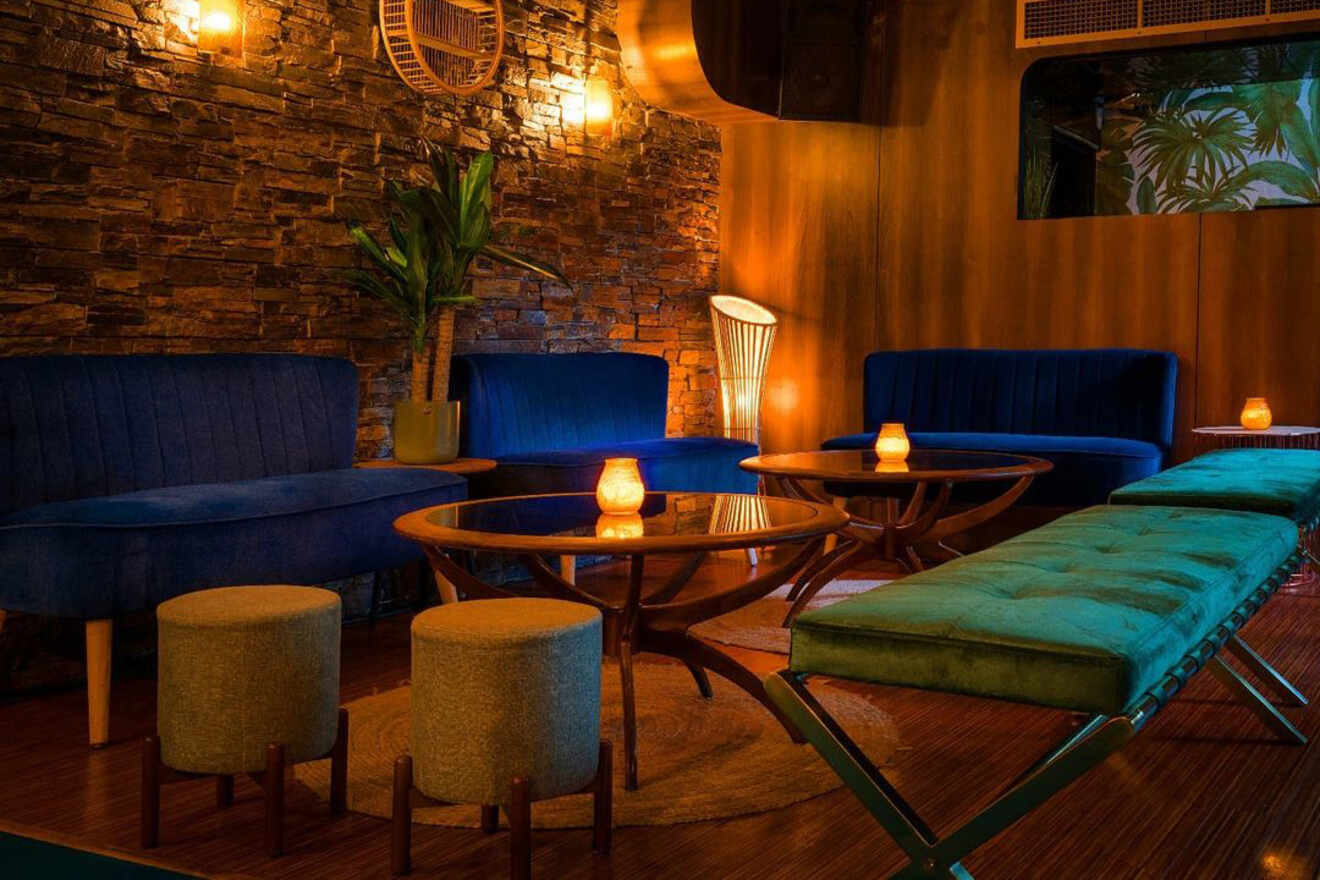 A retro-style lounge with mid-century modern furniture, wooden accents, and warm lighting, providing an intimate setting for relaxation.