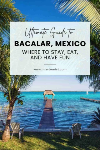 A serene lakeside scene with a wooden pier extending into clear blue water, surrounded by green palms. Text overlay reads: "Ultimate Guide to Bacalar, Mexico - Where to stay, eat, and have fun.