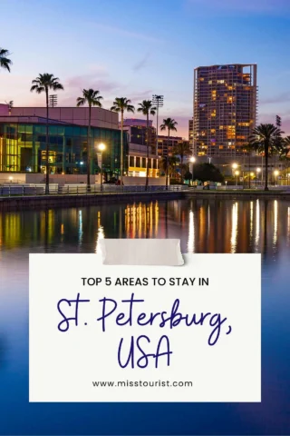 A waterside view with palm trees and a lit-up skyline at dusk in St. Petersburg, USA; text overlay: "Top 5 Areas to Stay in St. Petersburg, USA" with website www.misstourist.com.