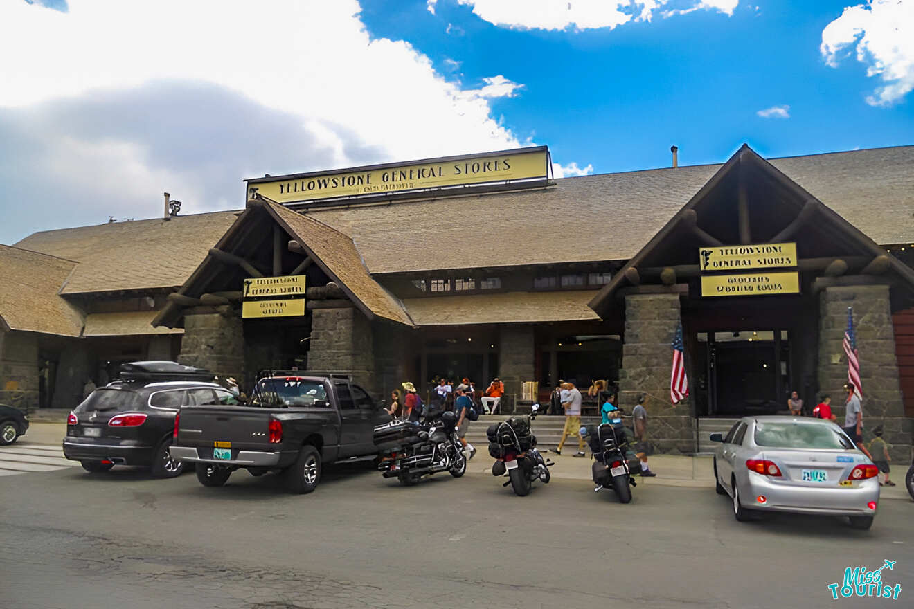 Exterior view of Yellowstone General Stores with parked vehicles and motorcycles in front.