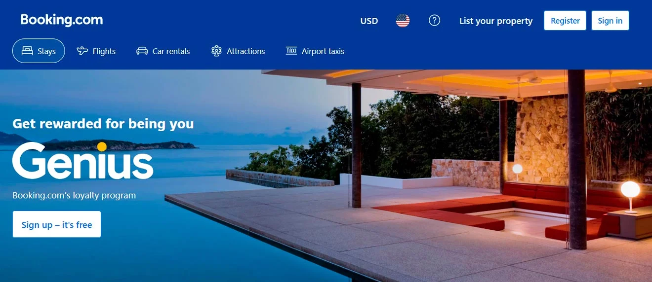 Booking.com homepage featuring a coastal resort with a pool and stone patio. The advertisement promotes the Genius loyalty program with options for registration and property listing.