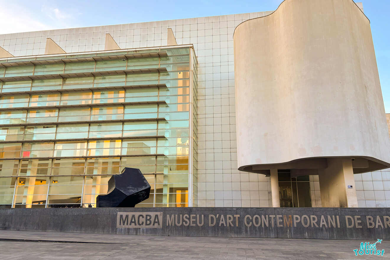 Facade of MACBA, Museu d'Art Contemporani de Barcelona, featuring modern architecture with large glass panels and a curved white section.