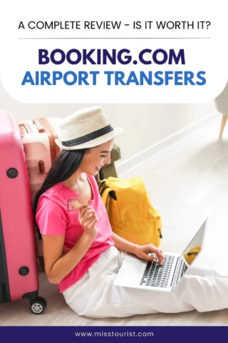 Woman sitting on the floor with a laptop and credit card, next to luggage. Text reads: "Booking.com Airport Transfers: A Complete Review – Is It Worth It?.