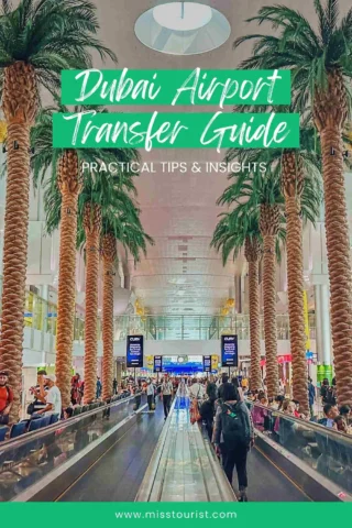 Crowded airport scene with travelers on moving walkways, surrounded by tall palm trees and overhead signage reading "Dubai Airport Transfer Guide.