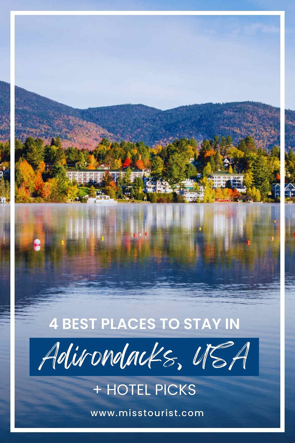 Scenic view of Adirondack Mountains with colorful autumn foliage reflected in a lake, surrounded by hotels and lodges. Text overlay: 