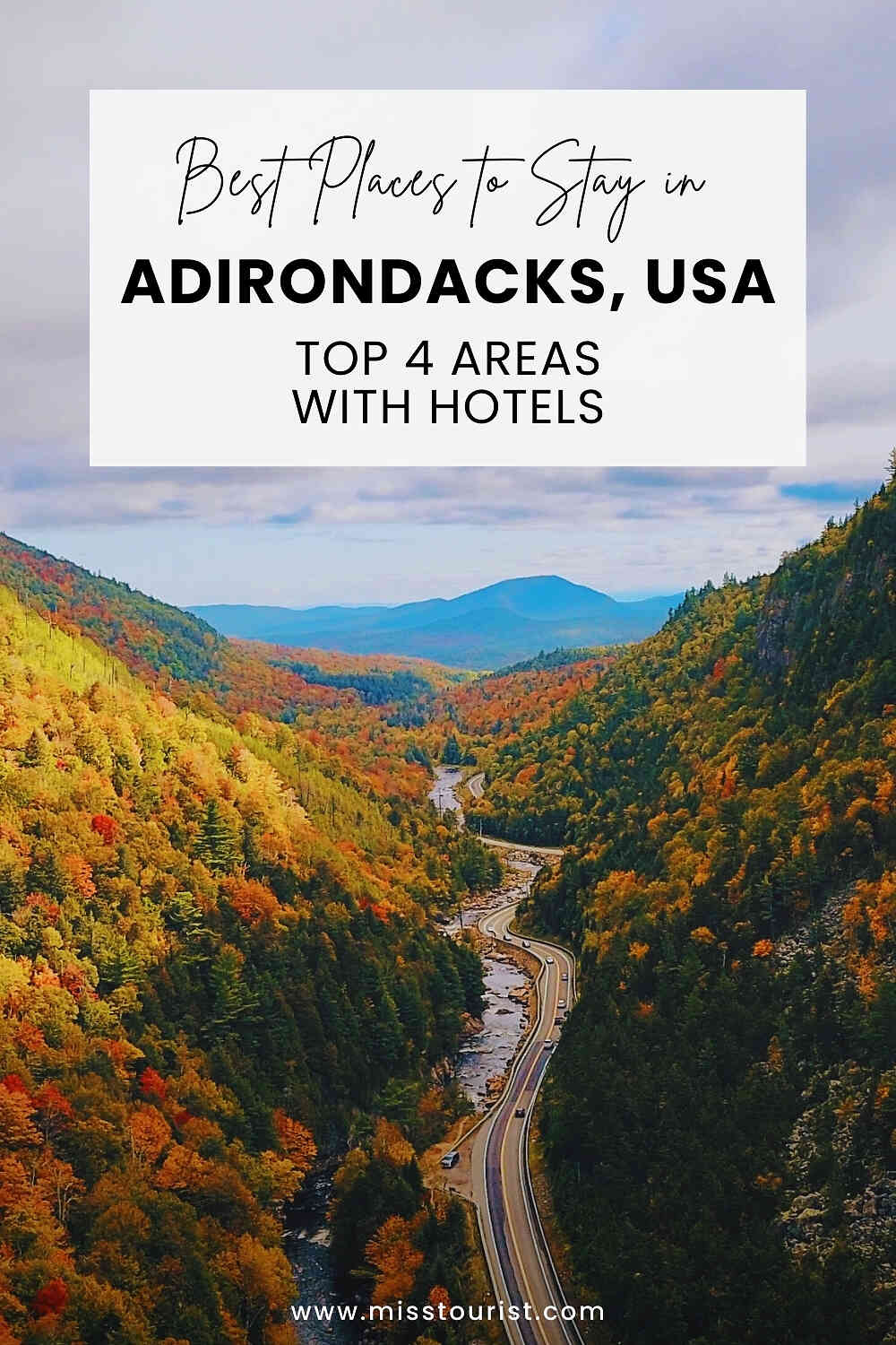 Aerial view of a winding road through a valley with colorful autumn trees, mountains, and a clear sky. Text overlay promotes top hotel areas in Adirondacks, USA.