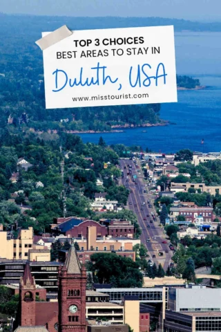 Aerial view of Duluth, USA, featuring buildings, roads, and Lake Superior in the background. Text overlay reads, "Top 3 choices best areas to stay in Duluth, USA.