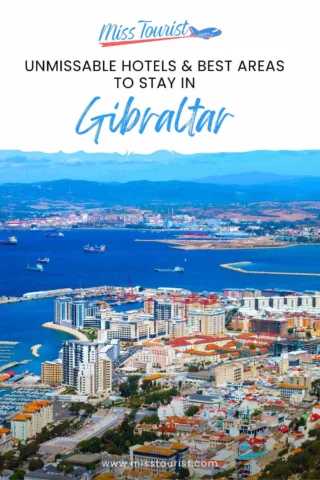 Aerial view of Gibraltar with buildings, coastline, and the sea. Text reads: "Unmissable Hotels & Best Areas to Stay in Gibraltar" with "Miss Tourist" logo at the top.